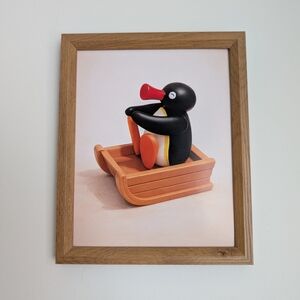 Pingu on sled print in wooden frame, 9x11 inches, frame is included